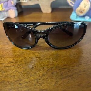 Prada sunglasses in generic case with COA